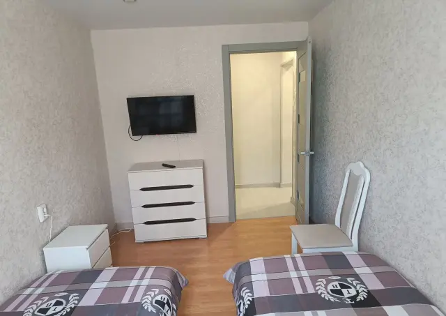 Спальня с двумя кроватями